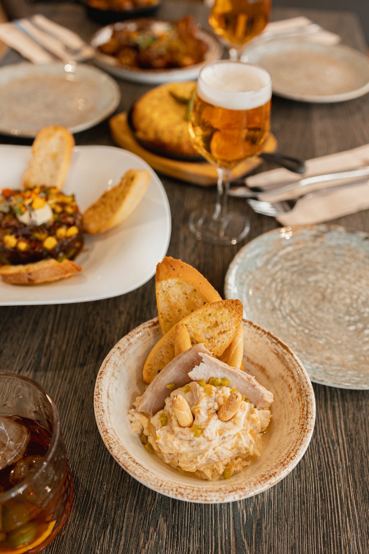 Russian salad, steak tartare and a draught beer at Can Frasquet, Palma