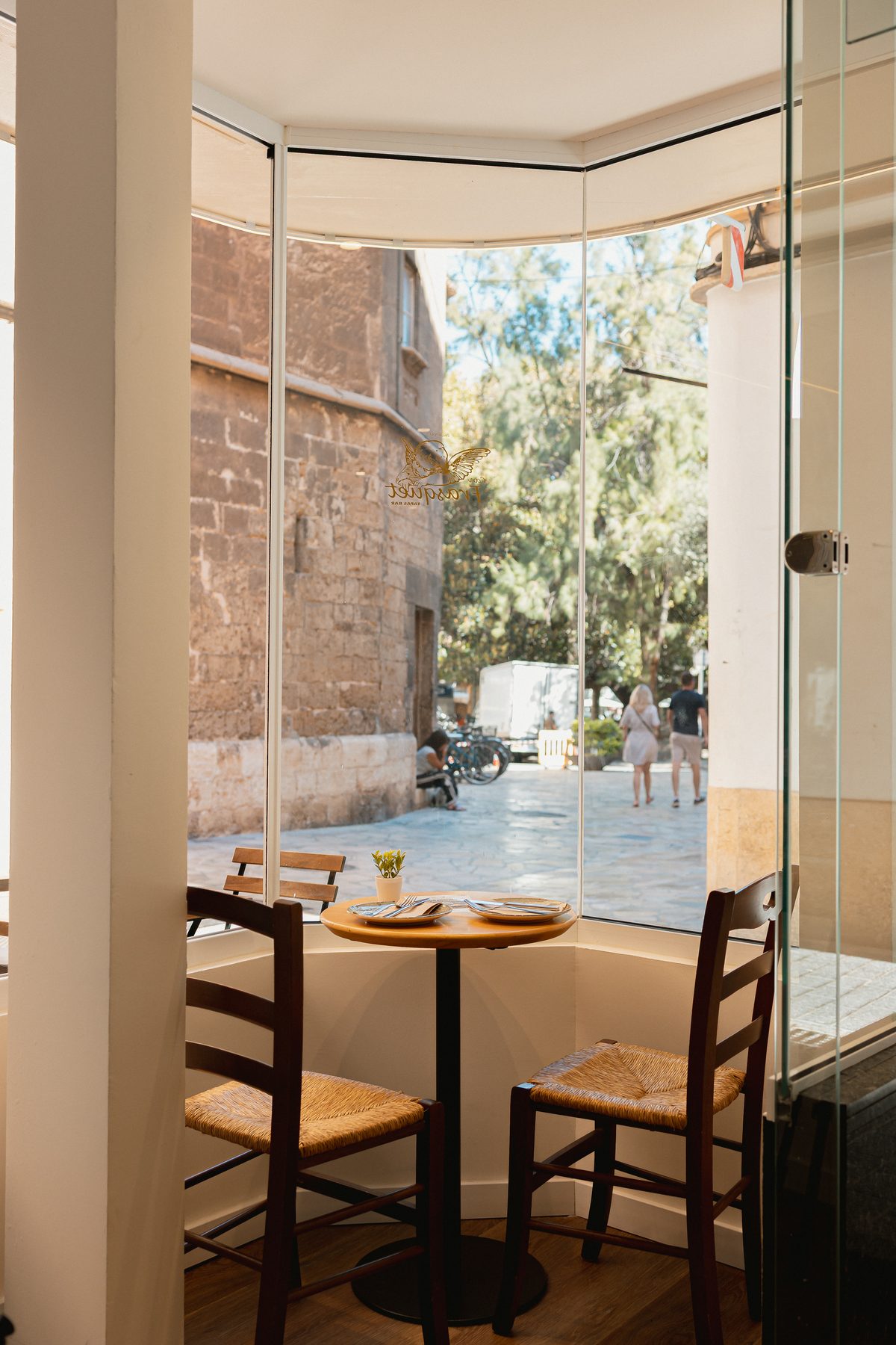 Table by the window overlooking the street at Can Frasquet, Palma